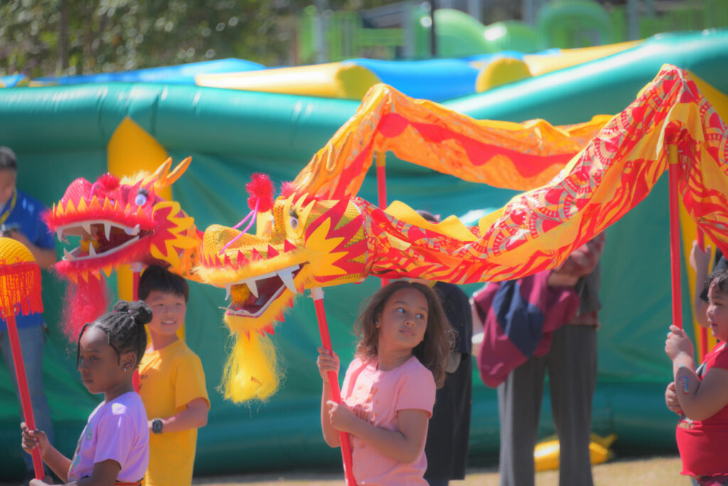 Children participate in a youth dragon dance at the 2026 Atlanta Dragon & Loong Festival.